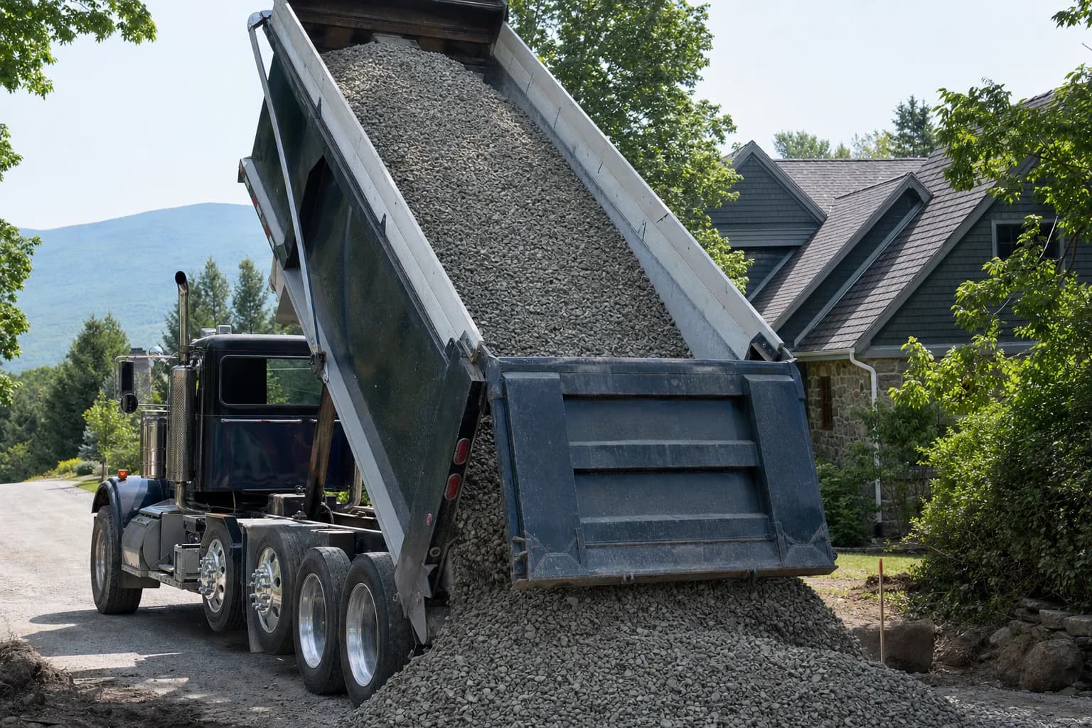 Dump truck delivering gravel